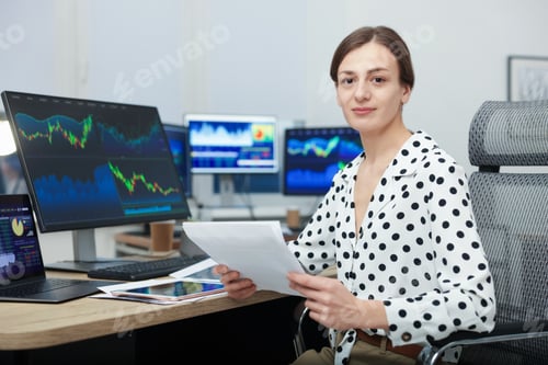 Preview: Stock exchange. Woman working at desk in office