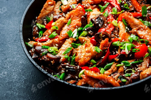 Preview: Stir fry with turkey fillet, paprika, mushrooms, green chives and sesame seeds in frying pan