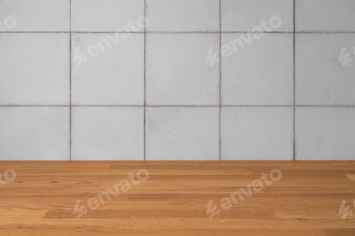 Preview: A blank light gray tiled wall and wooden countertop in natural light.