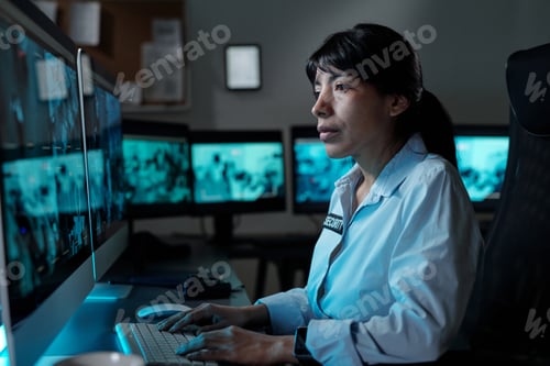 Preview: Female guard typing on computer keyboard