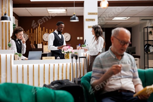 Preview: Hotel reception: Staff assists check-in