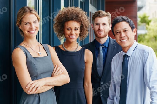 Preview: Portrait of a group of happy young professionals standing together outside