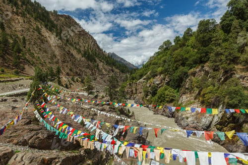 Preview: Lungta buddhist prayer flags in Lahaul valley over Chandra river