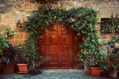 Preview: Retro wooden door outside old Italian house in a small town of Pienza, Italy. Vintage