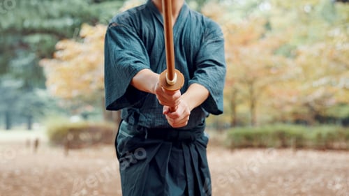 Preview: Bokken, Japanese person and outdoor as practice, exercise and sport in culture or martial arts. Per