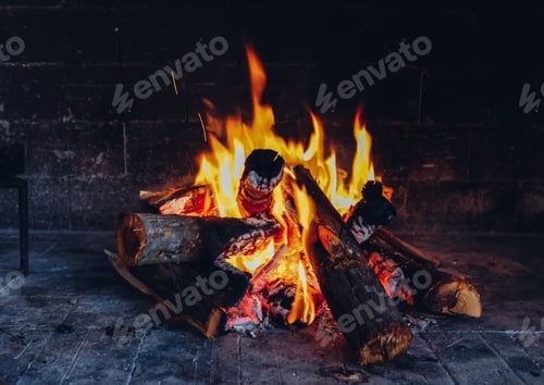 Burning Logs in Fireplace with Bright Yellow Flames