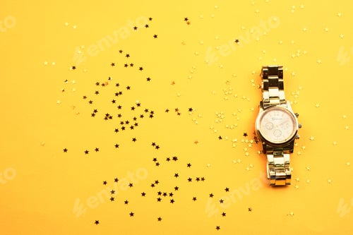 Preview: Wristwatch on yellow background and Copy Space glitter