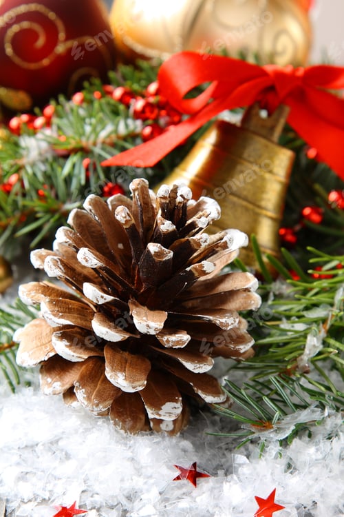 Preview: Pinecone with christmas decoration and snow
