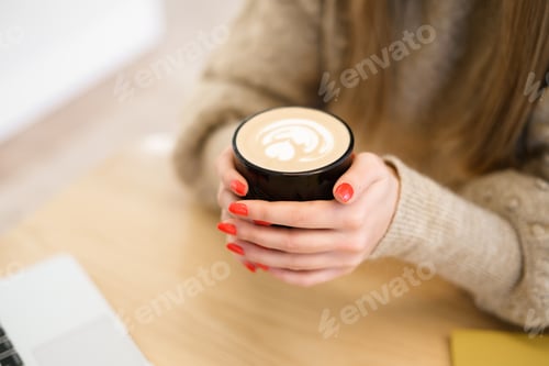 Preview: Woman hold coffee in hands