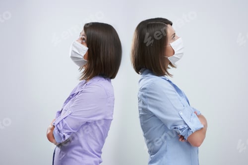 Preview: Attractive woman wearing protective mask isolated over white background