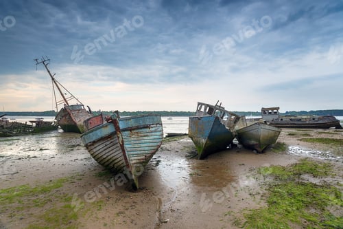 Preview: Abandoned fishing boats under a brooding sky