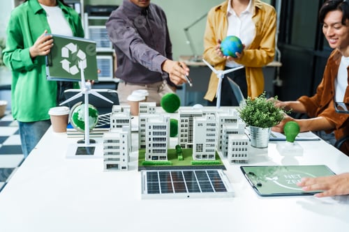 Preview: Colleagues meet at desk brainstorm environmental management strategies. discuss carbon emissions