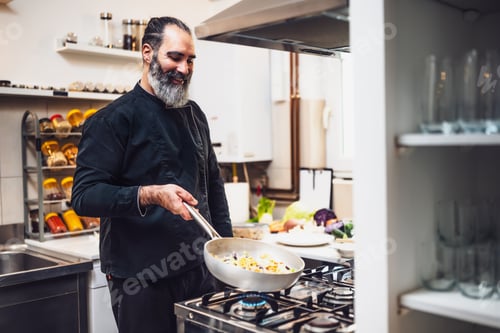 Preview: Cook working in kitchen