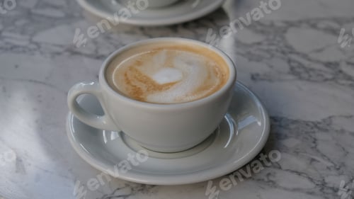 Preview: Cappuccino Coffee Close-Up on Marble Table