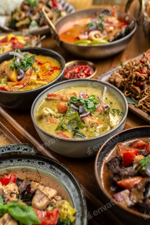 Preview: mix of traditional thai curries on restaurant table in phuket thailand