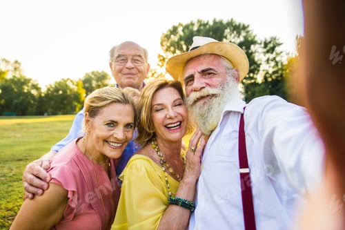 Preview: Group of senior people bonding outdoors