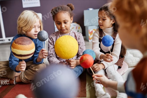 Preview: Cute little learners of primary school studying astronomy