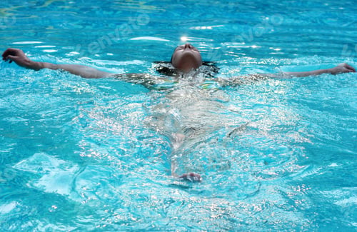 Preview: A woman swim in the swimming pool