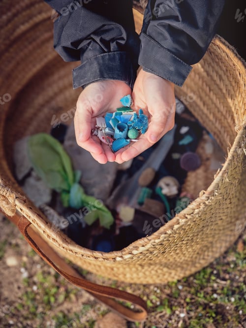 Preview: Crop boy with pieces of plastic for recycling