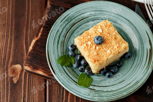 Preview: Piece of cake Napoleon on green plate