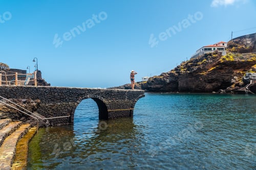 Preview: A young woman on vacation in the seaside tourist village Tamaduste on the island of El Hierro