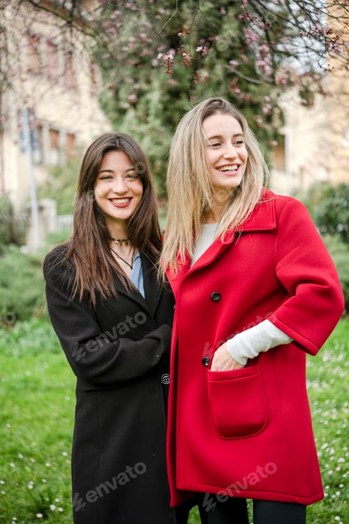 Preview: Two friends sharing a joyful moment outdoors