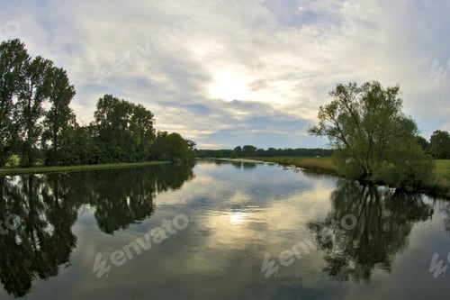 Preview: Aerial shot of sky and forest reflection on the peaceful river