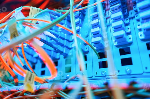 Preview: Illuminated patch panel inside server cabinet with connected cables