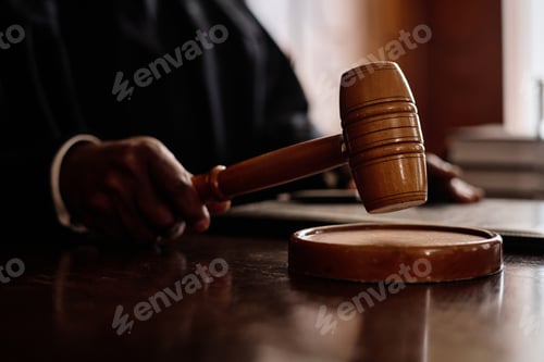Preview: Focus on wooden gavel held by impartial judge announcing verdict to suspect