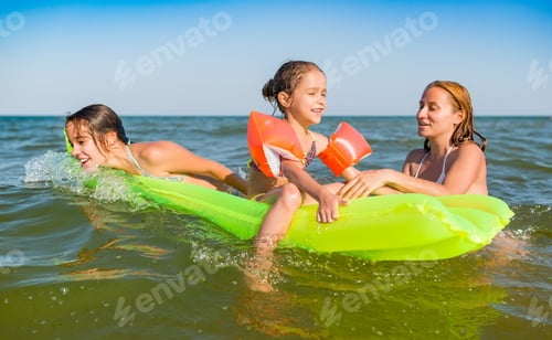 Preview: Happy mother and two small positive daughters