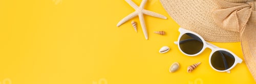 Preview: top view with copy space of sunglasses and hat with starfish on yellow background.