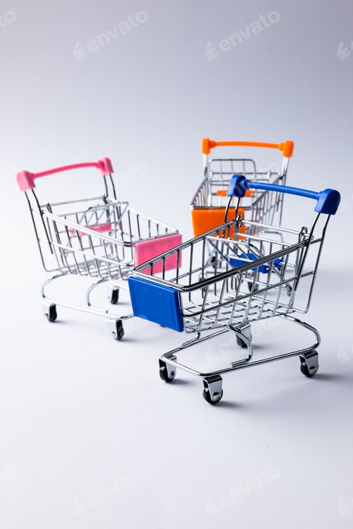 Preview: Composition of shopping carts and copy space on white background