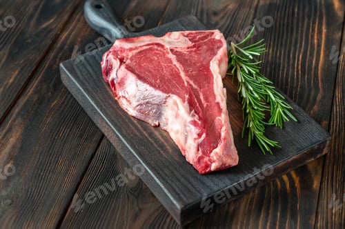 Preview: Raw T-bone steak with fresh rosemary