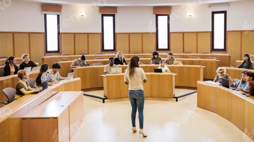Preview: University class in a circular classroom with students of different origins and the teacher