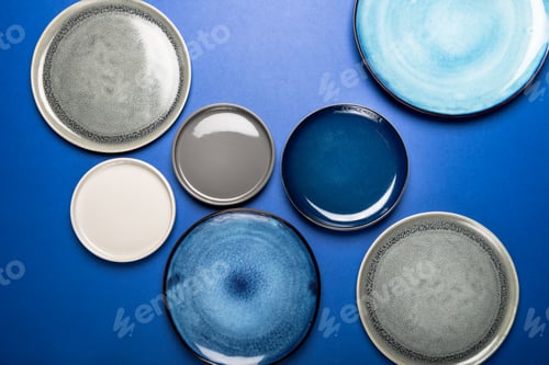 Preview: Empty Blue Plates on Grey Background