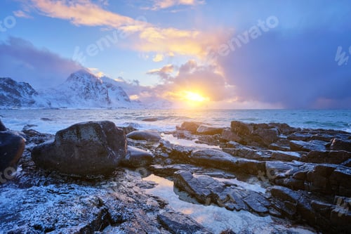 Preview: Coast of Norwegian sea on rocky coast in fjord on sunset