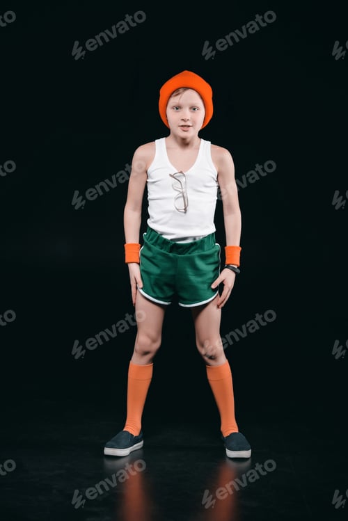 Preview: Smiling sporty boy with eyeglasses exercising isolated on black