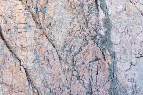 Preview: Rocky background with textured wall in bright light
