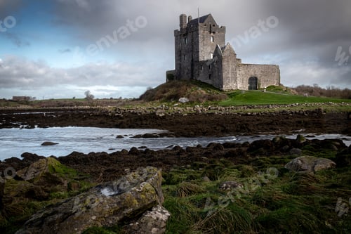 Preview: Breathtaking view of the Dunguaire Castle in Kinvara, Ireland on dark cloudy sky background