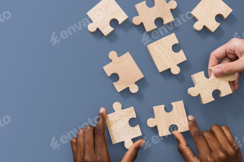 Preview: Hands holding puzzle business problem solving concept