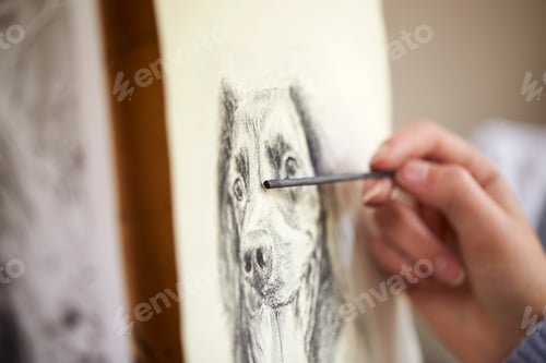 Preview: Close Up Of Artist Sitting At Easel Drawing Picture Of Dog In Charcoal
