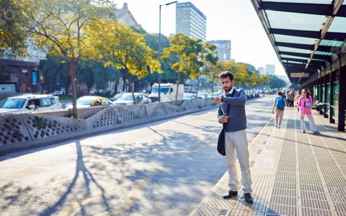 Preview: latina american man commuter looking at the time waiting for transportation