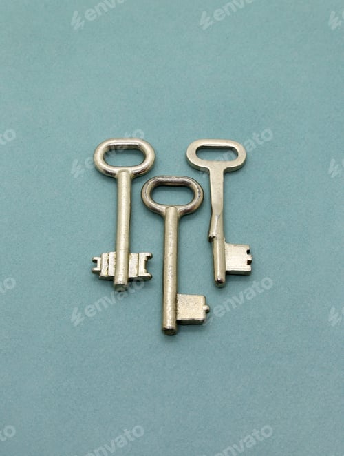Preview: Several old metal keys on green background