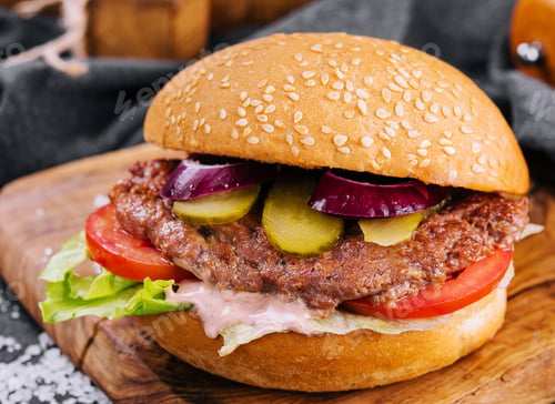 Preview: Close-up of home made burger on wooden tray
