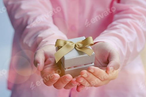 Preview: Presenting a Silver Gift Box with Golden Ribbon