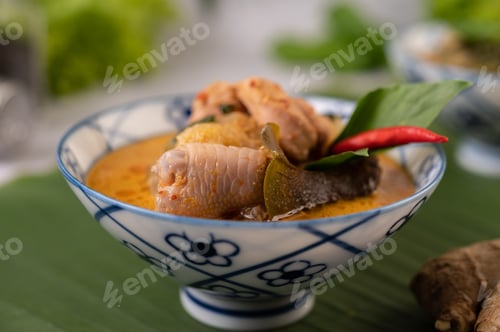Preview: Chicken curry with Wax gourd in a ceramic cup.