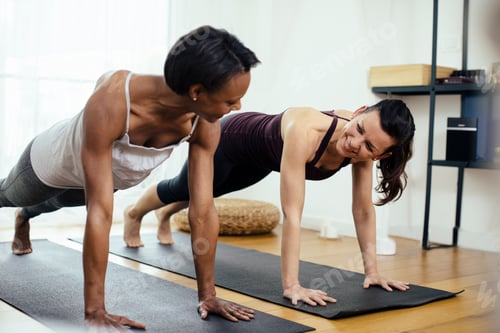 Preview: Two women doing gymnastics at home