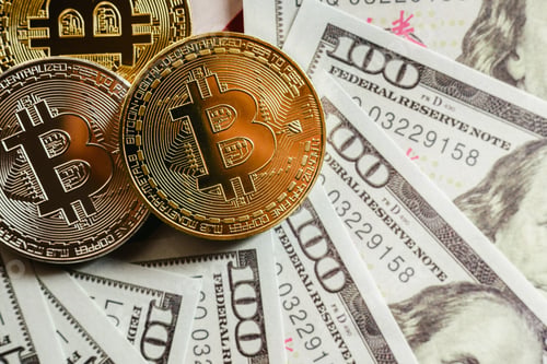 Preview: real bitcoins with a value higher than hundreds of dollars in bills.
