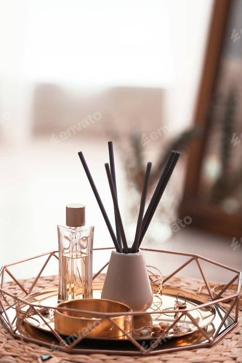 Preview: Composition with stylish accessories and interior elements on wicker pouf indoors