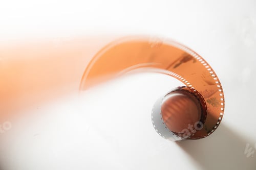Preview: Dynamic Curled Film Strip on White Background